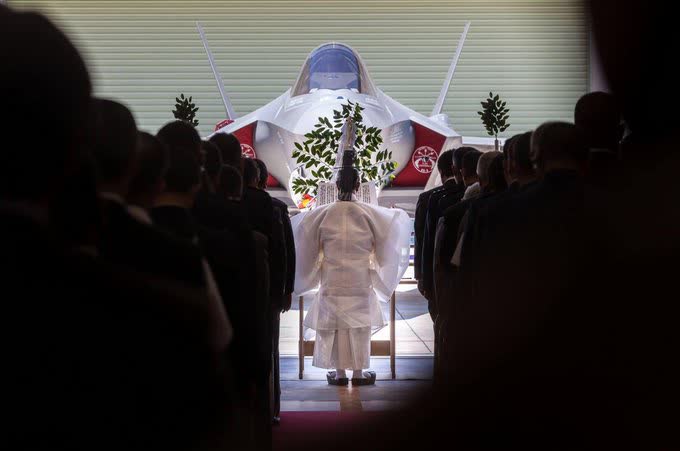 Shinto priest blessing a F35.jpg